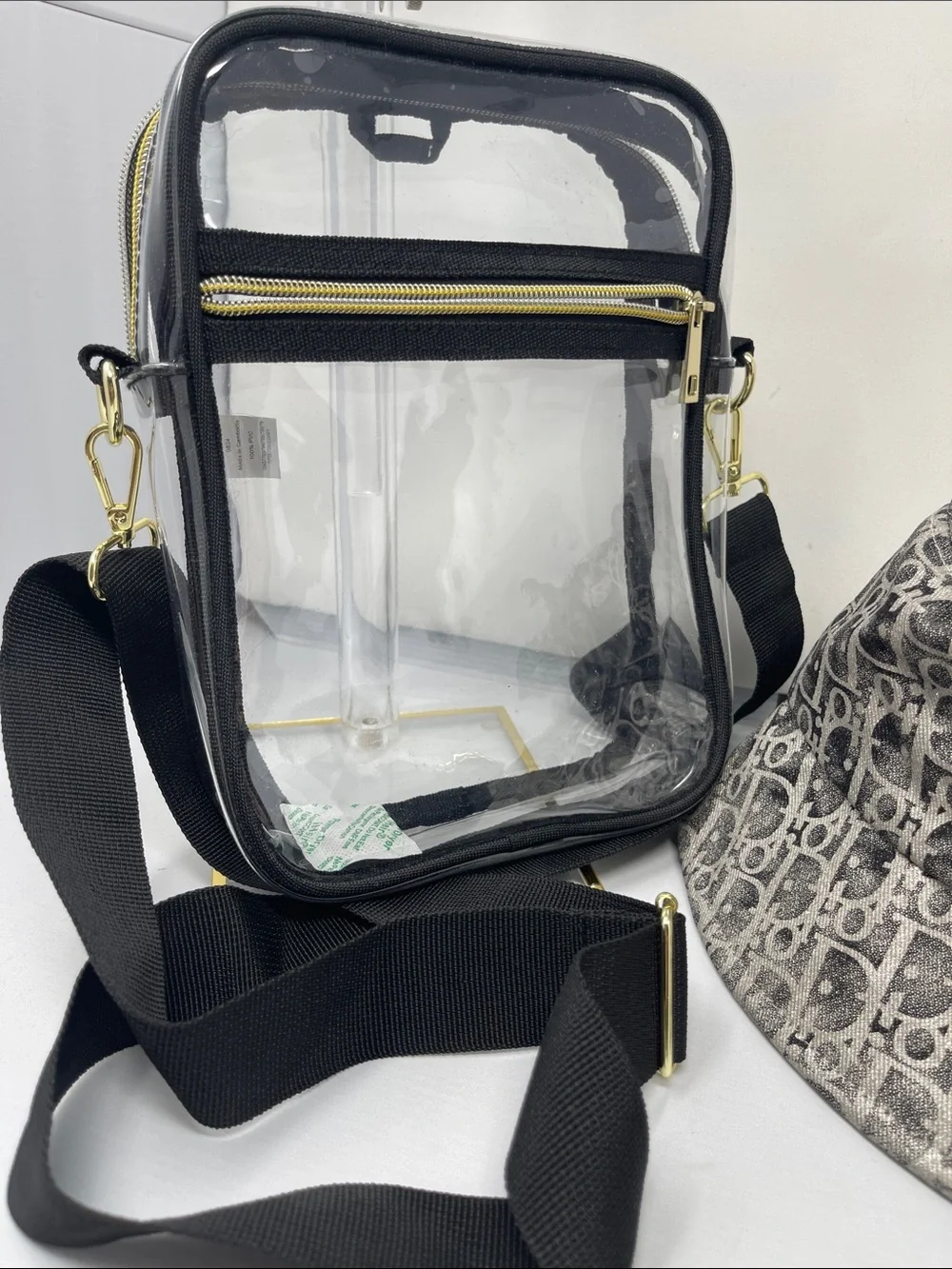 Fashion monogram bucket hat with gold and metallic gray accents & Clear bag